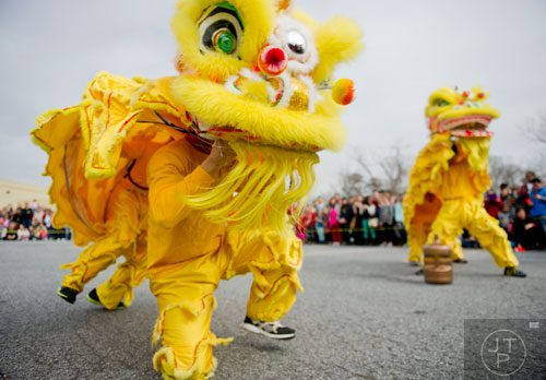 Chris Fun (left) performs as a Fu dog during the Atlanta Chinese Lunar New Year Festival in Chamblee on Saturday, February 1, 2014. 