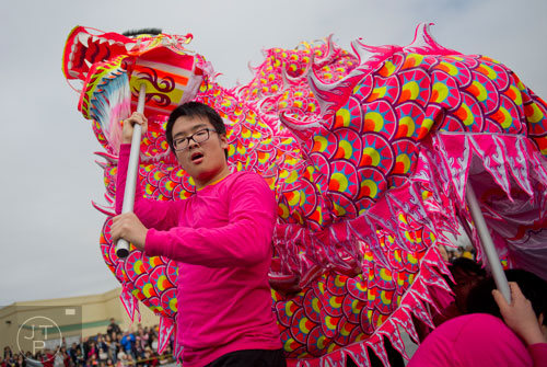Harold Lin (left) moves the head of the paper dragon as he performs during the Atlanta Chinese Lunar New Year Festival in Chamblee on Saturday, February 1, 2014. 