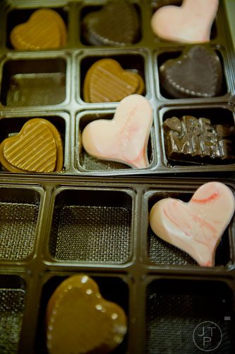 Chocolate hearts sit in trays at Chamberlain's Chocolate Factory in Peachtree Corners on Tuesday, February 4, 2014.