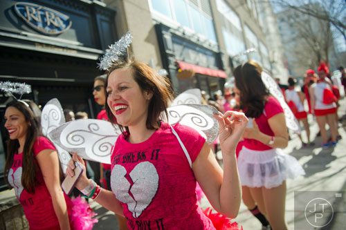 Julie Santana (center) walks down the street as she waits for the start of the Cupid Undies Run in Midtown on Saturday, February 15, 2014. 