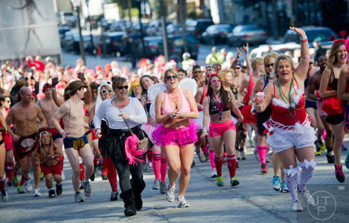Runners take off from the starting line during the Cupid Undies Run in Midtown on Saturday, February 15, 2014. 