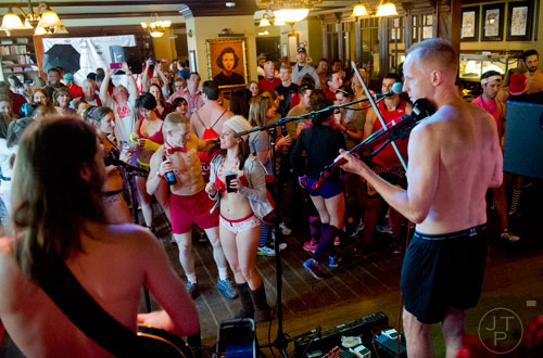Stewart Wyne (center left) dances with his wife Tiffany during the after party for the Cupid Undies Run at Ri Ra Irish Pub in Midtown on Saturday, February 15, 2014. 