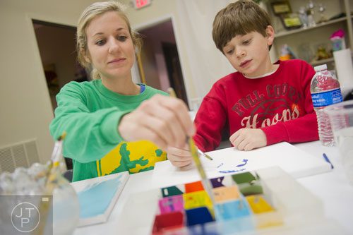 Kristi White (left) paints with her son Bryce during Mother-Son Date Night at Saville Studios in Peachtree City on Saturday, February 15, 2014. 
