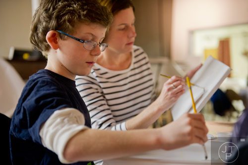 Matthew Gloriod (left) paints with his mother Amanda during Mother-Son Date Night at Saville Studios in Peachtree City on Saturday, February 15, 2014. 