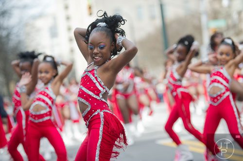 Haleigh Blackmon dances her way down Auburn Ave. in Atlanta during the Black History Month Parade on Saturday, February 22, 2014.