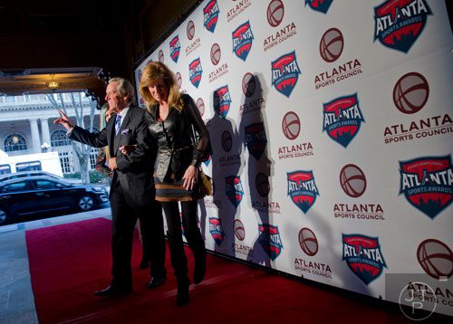 ESPN broadcaster Brad Nessler (left) walks the red carpet with his family during the 9th annual Atlanta Sports Awards at the Fox Theatre on Wednesday, March 5, 2014. 