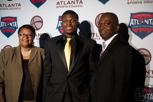 Norcross High School's Lorenzo Carter walks the red carpet with his mother Lisa and father Leo during the 9th annual Atlanta Sports Awards at the Fox Theatre on Wednesday, March 5, 2014. 