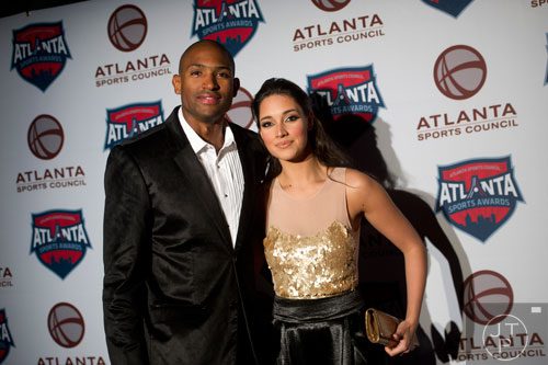 Atlanta Hawks' Al Horford (left) walks the red carpet with his wife Amelia Vega during the 9th annual Atlanta Sports Awards at the Fox Theatre on Wednesday, March 5, 2014. 