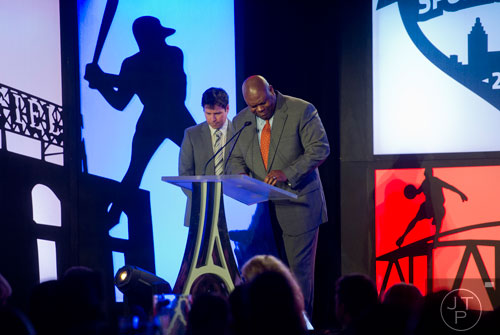 Derrick Moore (right) gives the invocation for the 9th annual Atlanta Sports Awards at the Fox Theatre on Wednesday, March 5, 2014.