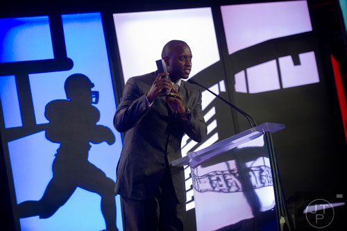 D.J. Shockley accepts the award for Collegiate Athlete of the Year for Aaron Murray during the 9th annual Atlanta Sports Awards at the Fox Theatre on Wednesday, March 5, 2014. 