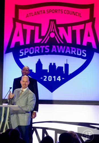 Matt Bryant (center) receives the 2014 Community Spirit Award during the 9th annual Atlanta Sports Awards at the Fox Theatre on Wednesday, March 5, 2014. 
