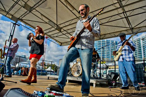 Jason Beard (center) and Abby Wren from Second Hand Swagger perform on stage during the second annual Atlanta Taste of The Trucks Festival in a parking lot off of Spring and 8th streets in downtown Atlanta on Saturday, March 29, 2014. 