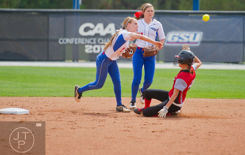 Georgia State's Taylor Anderson (left) turns the double play as UL Lafayette's Kassidy Zeringue slides late into second base during their game on Saturday, March 22, 2014.