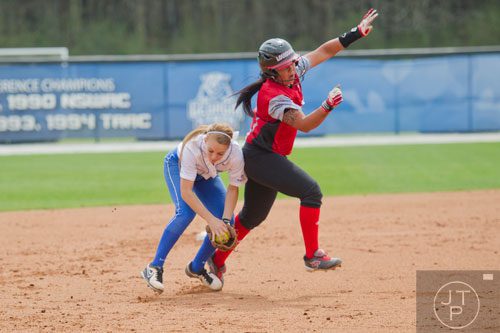 Georgia State's Taylor Anderson (left) collides with UL Lafayette's Samantha Walsh for the out during their game on Saturday, March 22, 2014.