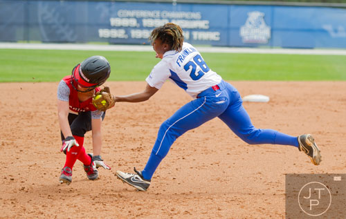 Georgia State's MeQuilla Franklin (28) tags out UL Lafayette's Kendall Smith (20) as she runs down the third base line during their game on Saturday, March 22, 2014.