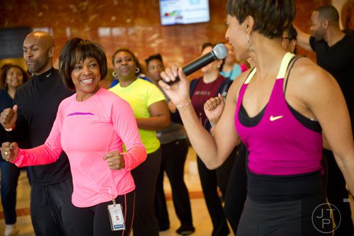 Dr. Valerie Montgomery Rice (left), Dean and Executive Vice President of the Morehouse School of Medicine in Atlanta, works out with around 40 women during the kickoff for her 12 week challenge to lose 15 inches on Saturday, March 1, 2014. 