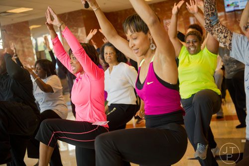 Dr. Valerie Montgomery Rice (left), Dean and Executive Vice President of the Morehouse School of Medicine in Atlanta, works out with around 40 women during the kickoff for her 12 week challenge to lose 15 inches on Saturday, March 1, 2014. 