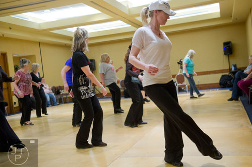 Kristi Davis (right) learns steps to the blurred lines during the Peach State Dance Festival at the Crown Plaza Ravinia hotel in Atlanta on Saturday, March 22, 2014.