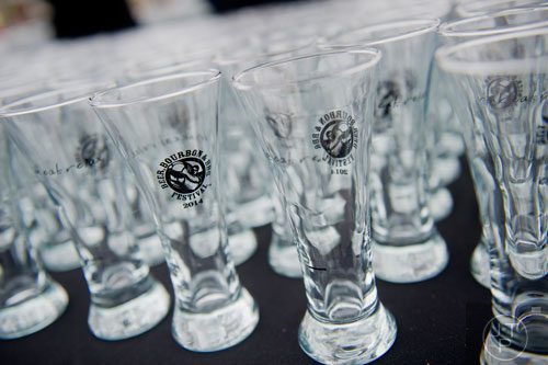 Tasting glasses sit on a table ready to be used during the Beer, Bourbon & BBQ Festival at Atlantic Station in Atlanta on Saturday, March 1, 2014. 
