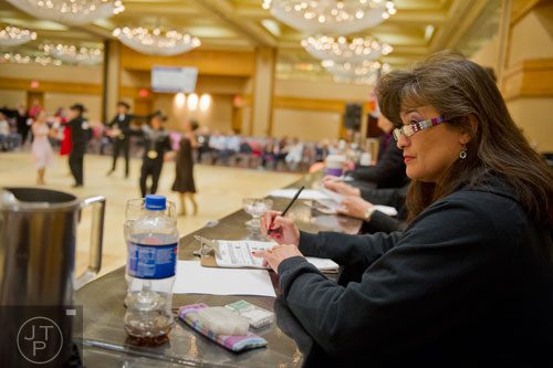 Lynae Jacob (right) judges one section of the dance competition portion of the Peach State Dance Festival at the Crown Plaza Ravinia hotel in Atlanta on Saturday, March 22, 2014.