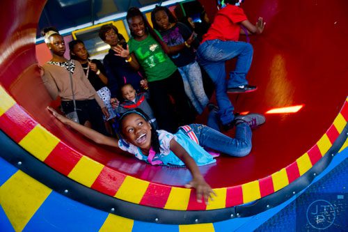 Keyonna Chaney (left) tumbles on a wheel as she tries to exit the Clown Around during the Atlanta Fair at Turner Field on Saturday, March 8, 2014. 