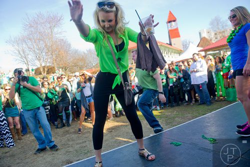 Kate Hill (center) competes in a dance contest during the 4th annual Lepre*CON at Park Tavern in Atlanta on Saturday, March 8, 2014. 