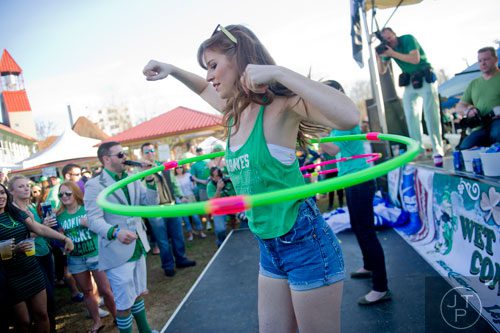 Brenda Naples (center) competes in a hula hoop contest during the 4th annual Lepre*CON at Park Tavern in Atlanta on Saturday, March 8, 2014. 