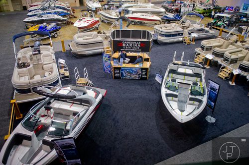 Boats and jet skis sit on display during the Spring Into Summer Boat Show at the Gwinnett Center in Duluth on Sunday, March 9, 2014. 
