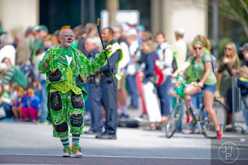 Lucky O'Brien walks down Peachtree St. during the Atlanta St. Patrick's Day Parade on Saturday, March 15, 2014. 