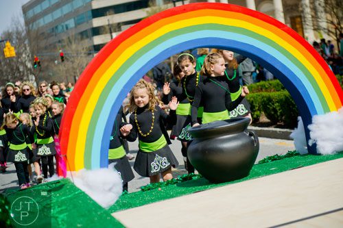 Annabelle Parker (center) dances her way down Peachtree St. during the Atlanta St. Patrick's Day Parade on Saturday, March 15, 2014. 