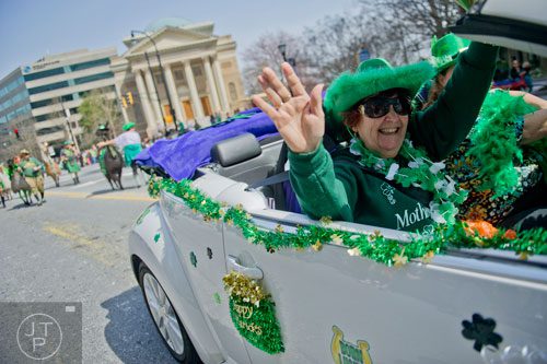 Nancy Korzen waves to the crowd during the Atlanta St. Patrick's Day Parade on Saturday, March 15, 2014. 