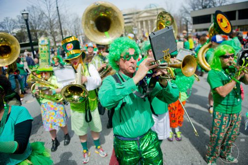 Bill Scott plays his trumpet down Peachtree St. during the Atlanta St. Patrick's Day Parade on Saturday, March 15, 2014. 