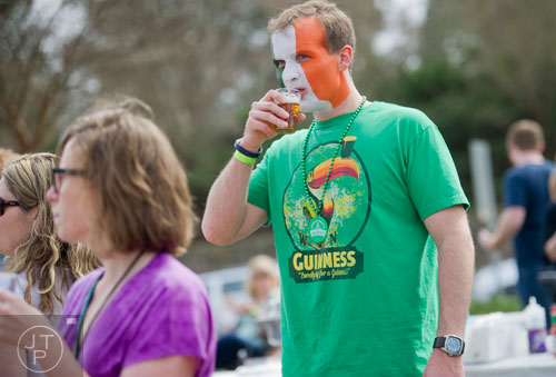 Kyle Tiedt takes a sip of his beer during the Roswell Beer Festival & Cornhole Tournament at historic Roswell square on Saturday, March 15, 2014. 