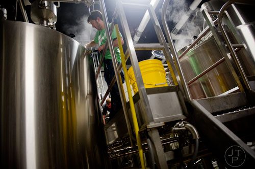 Adam Bishop preps a kettle of beer as he brews at Monday Night Brewing in Atlanta on Thursday, February 20, 2014.