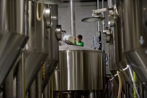 Adam Bishop preps a kettle of beer as he brews at Monday Night Brewing in Atlanta on Thursday, February 20, 2014.