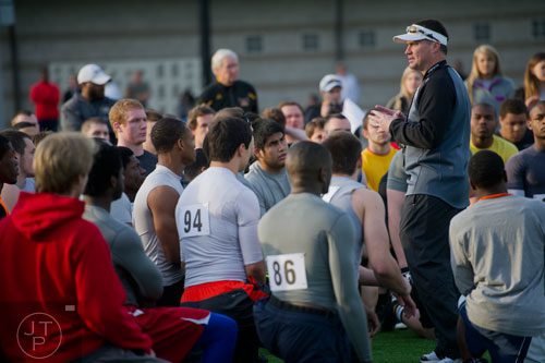 Head coach Brian Bohannon (right) talks to players for his potential team during the first tryouts for the new Kennesaw State University football team at The Perch on campus on Saturday, March 22, 2014. 