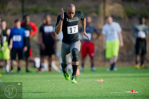 Justin Carswell sprints down the field for a 40 meter dash during the first tryouts for the new Kennesaw State University football team at The Perch on campus on Saturday, March 22, 2014. 