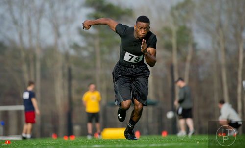 Justin Ragland hustles during a pro agility drill during the first tryouts for the new Kennesaw State University football team at The Perch on campus on Saturday, March 22, 2014. 