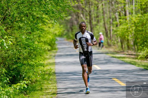 Curtis Samuel runs down the Silver Comet Trail in Mableton on Saturday, April 12, 2014.   