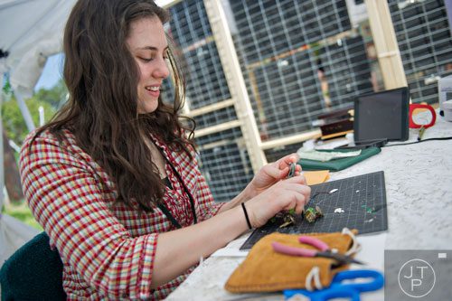 Ashley Barrett works on designing a piece of jewelry during the Sandy Springs Artsapalooza on Sunday, April 13, 2014. 