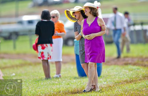 Victoria Garofalo (left) holds her mother Dianne as they have a photo taken during the 49th Annual Running of the Atlanta Steeplechase At Kingston Downs in Rome on Saturday, April 19, 2014. 