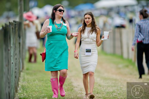 Bess Kelley (left) talks with Lauren Hagler during the 49th Annual Running of the Atlanta Steeplechase At Kingston Downs in Rome on Saturday, April 19, 2014. 