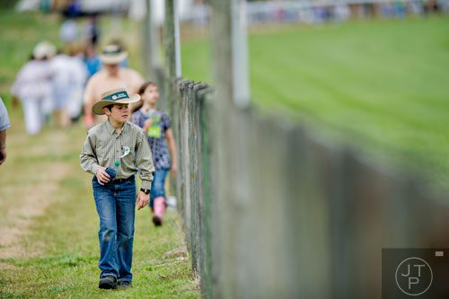 Will Hester looks onto the track as he walks next to it during the 49th Annual Running of the Atlanta Steeplechase At Kingston Downs in Rome on Saturday, April 19, 2014. 