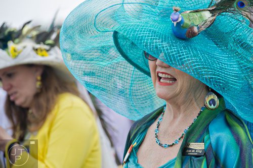Ann Marie King wears a bright blue peacock hat during the 49th Annual Running of the Atlanta Steeplechase At Kingston Downs in Rome on Saturday, April 19, 2014. 
