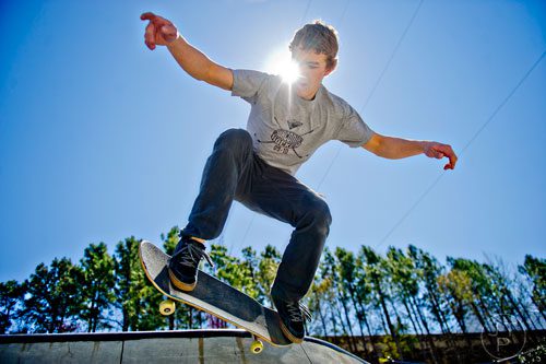 Harley Tolzmann catches some air as he rides his board at the Historic Fourth Ward Skatepark in Atlanta on Wednesday, March 26, 2014.