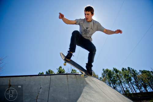 Harley Tolzmann catches some air as he rides his board at the Historic Fourth Ward Skatepark in Atlanta on Wednesday, March 26, 2014. 