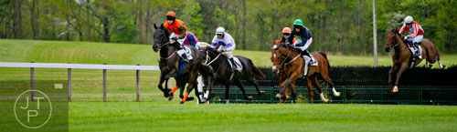 Jockey Jeff Murphy (left) rides Broxbourne as they lead the field in the Estates at Serenity Farm/Enghouse Transportation Sport of Kings Maiden Hurdle during the 49th Annual Running of the Atlanta Steeplechase At Kingston Downs in Rome on Saturday, April 19, 2014. 