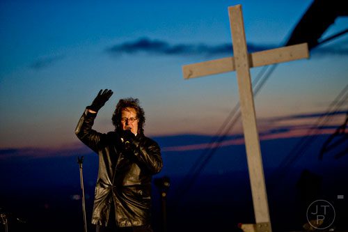 Brian Roos sings into the microphone on top of Stone Mountain before the start of the 70th annual Easter Sunrise Service on Sunday, April 20, 2014. 