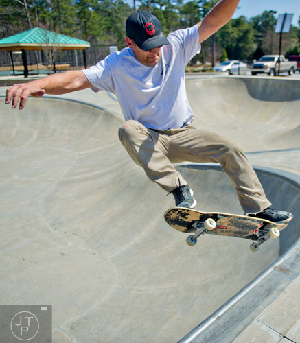 Troy Wilkas catches some air as he rides his skateboard at the Settles Bridge Skatepark in Suwanee on Thursday, March 27, 2014. 