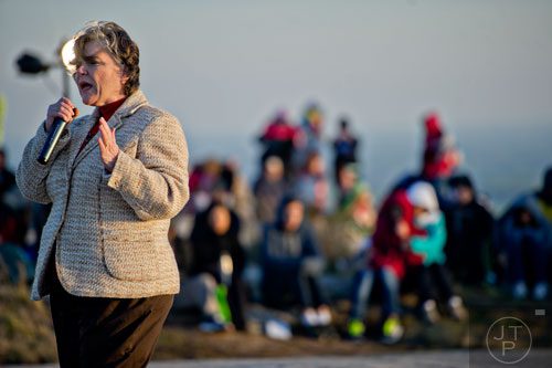 Rev. M. Deanne Lynch (right) from Mountain Park United Methodist Church delivers the message at the top of Stone Mountain during the 70th annual Easter Sunrise Service on Sunday, April 20, 2014. 